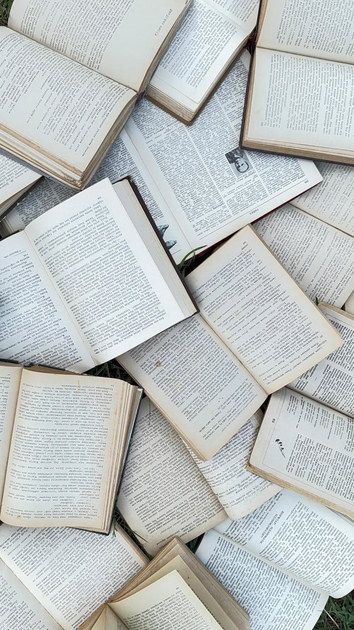 services-03 Collection of vintage open books scattered for study reference or research background.